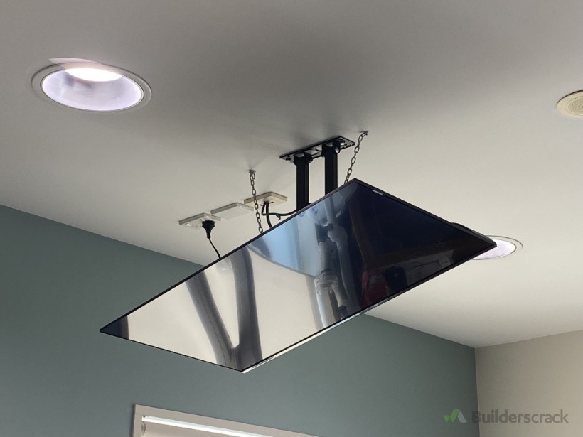 Large TV ceiling-mounted on a custom drop bracket