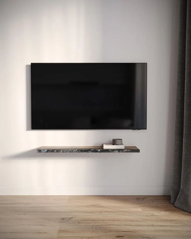 Slim wall-mounted TV above a floating shelf